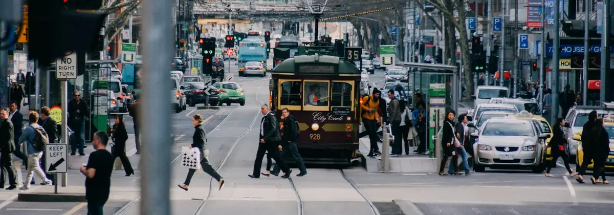 A Melbourne tram and pedestrians crossing