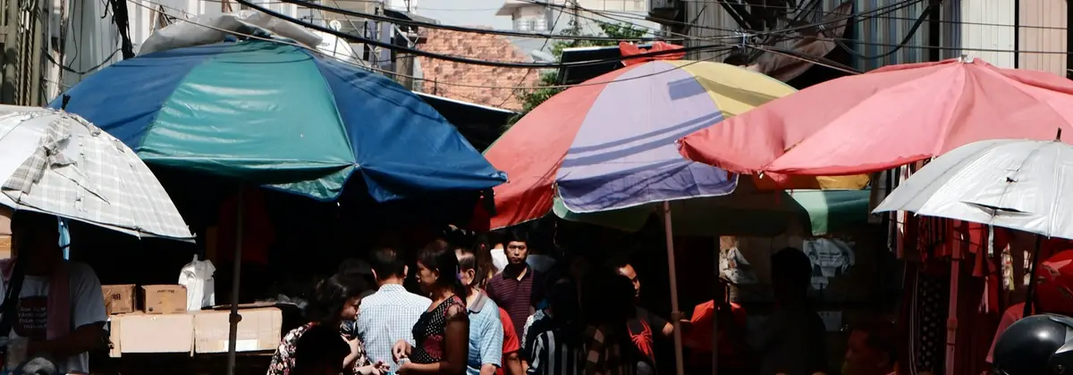Market umbrellas and crowds in Jakarta