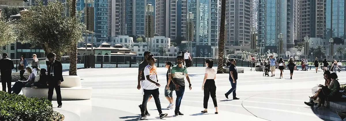 People walking across a plaza in Dubai