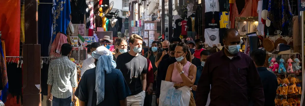 Shoppers walking through a Middle Eastern souk