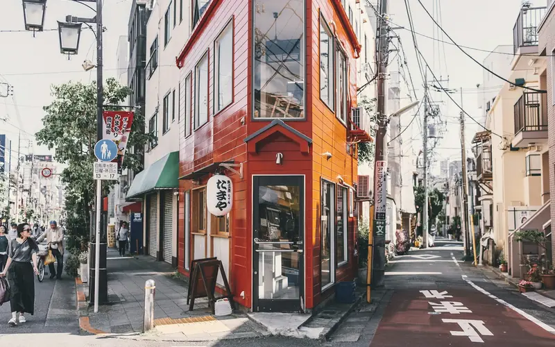 A traveller walking a Japanese street, already online